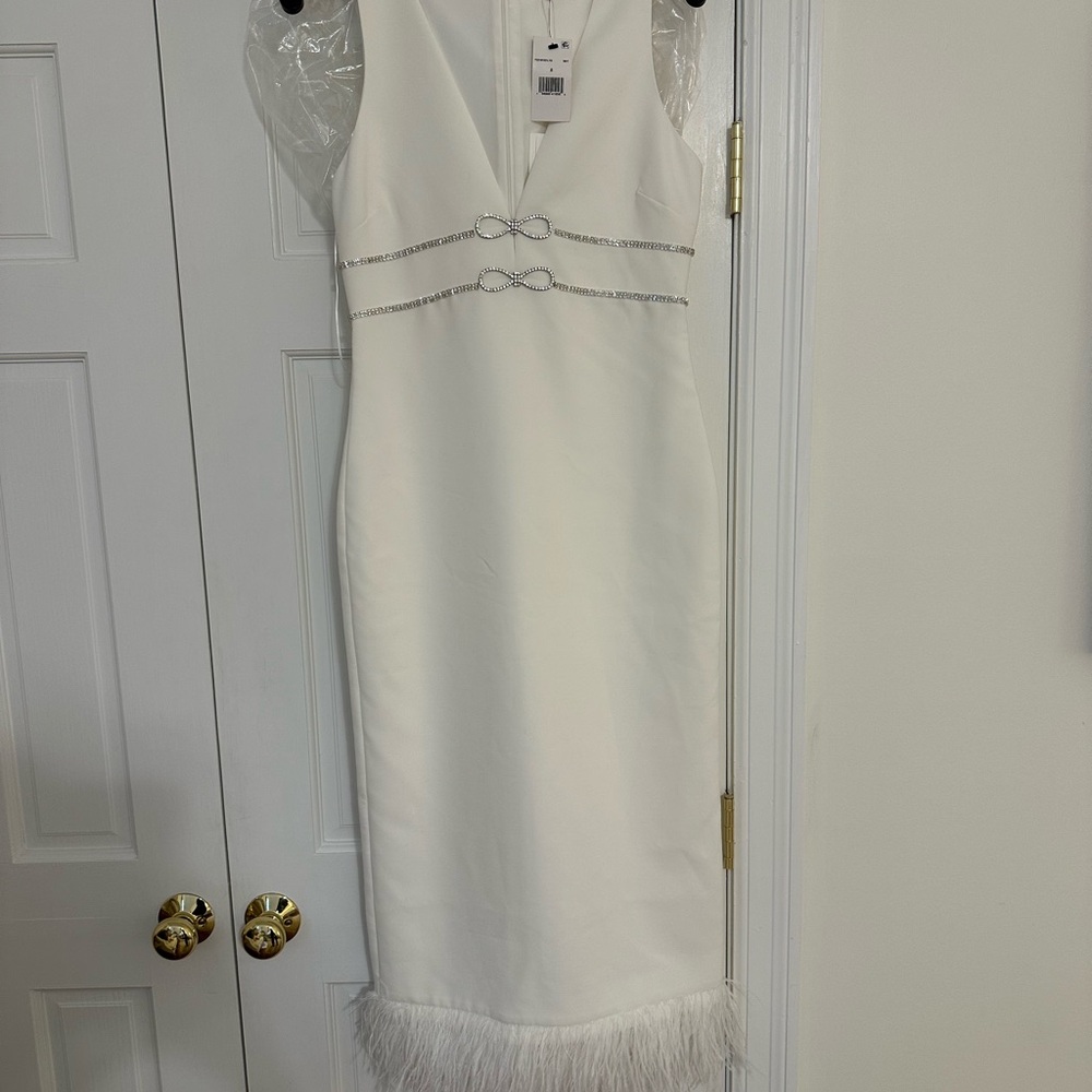 Elegant White Dress with Feather Hem